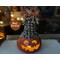 A dried gourd pumpkin collectable, named Noodle. His face is hand carved and the top is decorated with pine cone shells and natural berries.